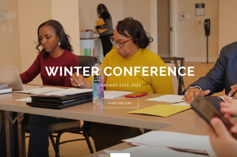 WinterWorkshop2026 - attendees sitting at tables reviewing materials