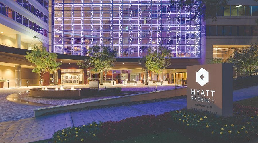 A front view of the Hyatt Regency Hotel and sign in Greenville, South Carolina.
